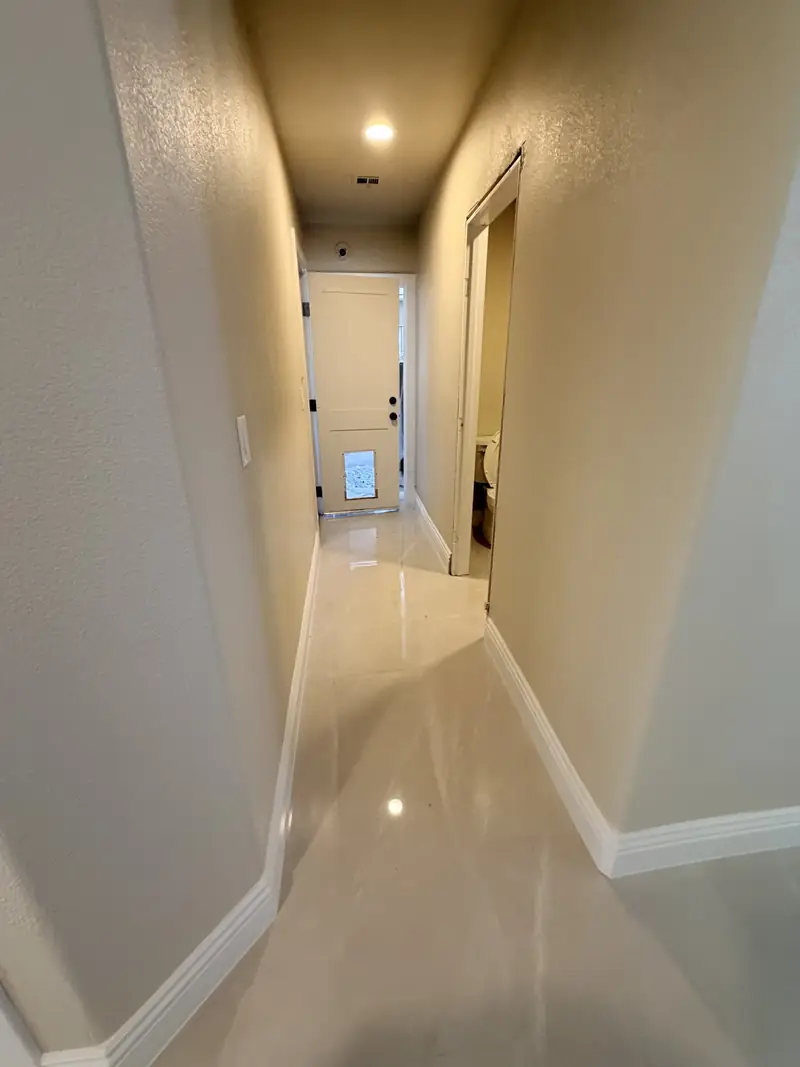 Finished tiled hallway with polished marble floor