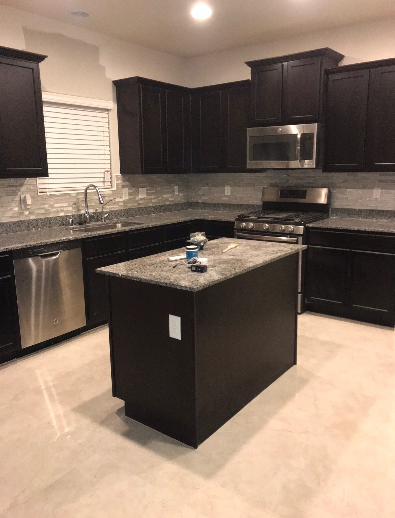 Kitchen with dark cabinets — before